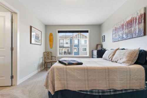 1403 Jumping Pound Common, Cochrane, AB - Indoor Photo Showing Bedroom