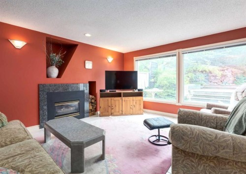 164 Hawksbrow Drive Nw, Calgary, AB - Indoor Photo Showing Living Room With Fireplace