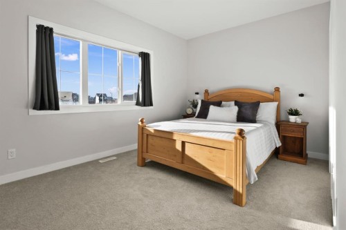 64-351 Monteith Drive Se, High River, AB - Indoor Photo Showing Bedroom