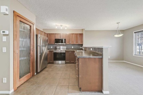 161 Eversyde Common Sw, Calgary, AB - Indoor Photo Showing Kitchen With Stainless Steel Kitchen