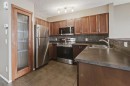 161 Eversyde Common Sw, Calgary, AB  - Indoor Photo Showing Kitchen With Stainless Steel Kitchen With Double Sink 