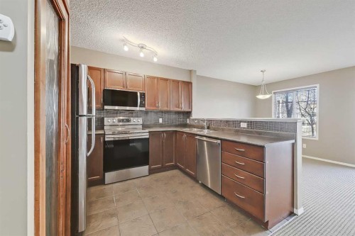 161 Eversyde Common Sw, Calgary, AB - Indoor Photo Showing Kitchen With Stainless Steel Kitchen