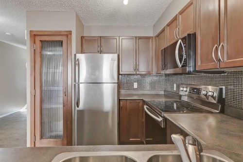 161 Eversyde Common Sw, Calgary, AB - Indoor Photo Showing Kitchen With Stainless Steel Kitchen