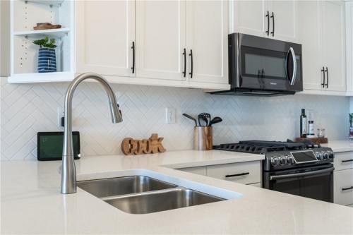 1103 Cornerstone Crescent, Olds, AB - Indoor Photo Showing Kitchen With Double Sink With Upgraded Kitchen
