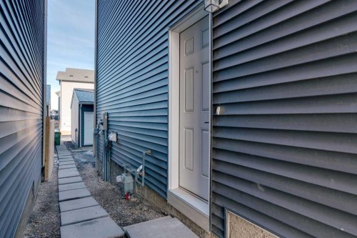 7582 202 Avenue Se, Calgary, AB - Outdoor With Fireplace