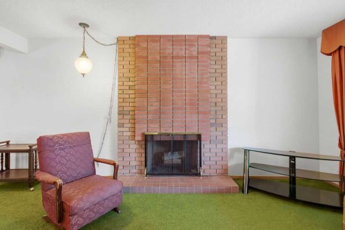 5516 Dalhart Hill Nw, Calgary, AB - Indoor Photo Showing Living Room With Fireplace