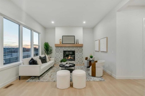 341 Limestone Bay, Balzac, AB - Indoor Photo Showing Living Room With Fireplace
