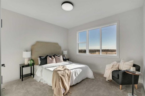 341 Limestone Bay, Balzac, AB - Indoor Photo Showing Bedroom