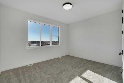 341 Limestone Bay, Balzac, AB - Indoor Photo Showing Other Room