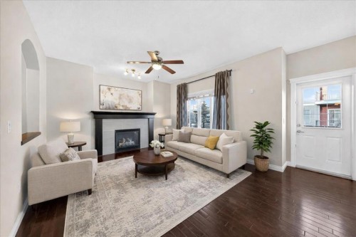 194 Sherwood Mount Nw, Calgary, AB - Indoor Photo Showing Living Room With Fireplace