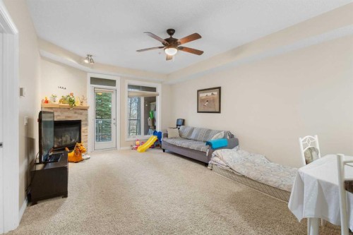 8103-14 Hemlock Crescent Sw, Calgary, AB - Indoor With Fireplace
