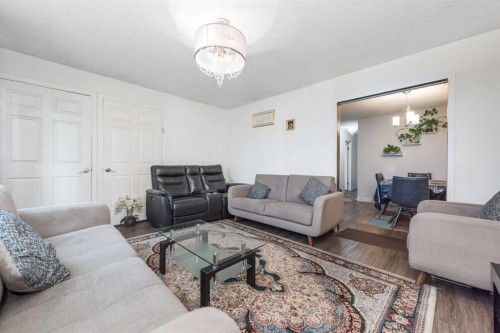 144 Rundleson Place Ne, Calgary, AB - Indoor Photo Showing Living Room