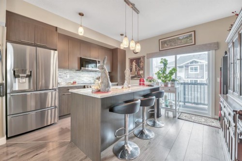 25-300 Marina Drive, Chestermere, AB - Indoor Photo Showing Kitchen With Stainless Steel Kitchen With Upgraded Kitchen