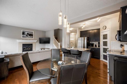526 New Brighton Drive Se, Calgary, AB - Indoor Photo Showing Kitchen With Fireplace With Upgraded Kitchen