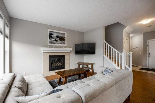 526 New Brighton Drive Se, Calgary, AB - Indoor Photo Showing Living Room With Fireplace
