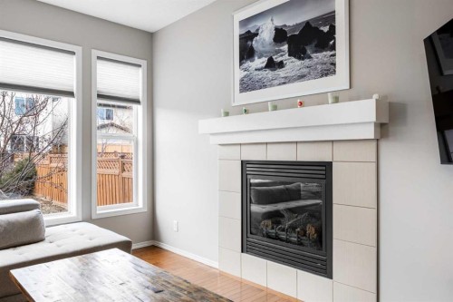526 New Brighton Drive Se, Calgary, AB - Indoor Photo Showing Living Room With Fireplace