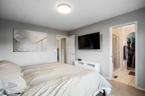 526 New Brighton Drive Se, Calgary, AB - Indoor Photo Showing Bedroom