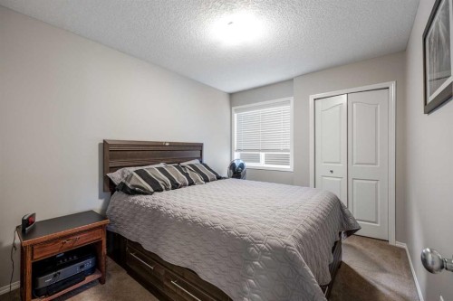 526 New Brighton Drive Se, Calgary, AB - Indoor Photo Showing Bedroom