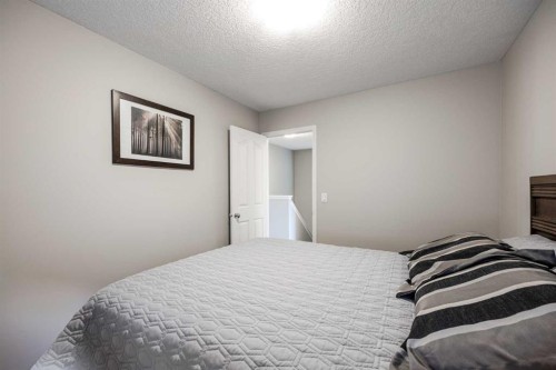 526 New Brighton Drive Se, Calgary, AB - Indoor Photo Showing Bedroom