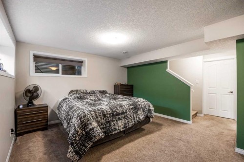 526 New Brighton Drive Se, Calgary, AB - Indoor Photo Showing Bedroom