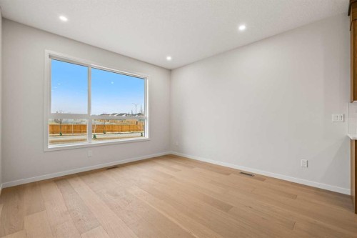 117 Bridgeport Gate, Chestermere, AB - Indoor Photo Showing Other Room With Fireplace