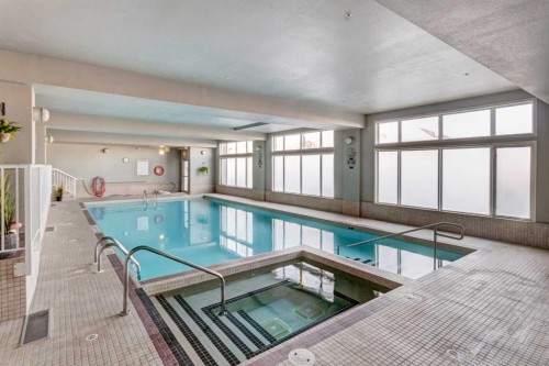 413-15 Everstone Drive Sw, Calgary, AB - Indoor Photo Showing Other Room With In Ground Pool