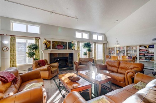 413-15 Everstone Drive Sw, Calgary, AB - Indoor Photo Showing Living Room With Fireplace