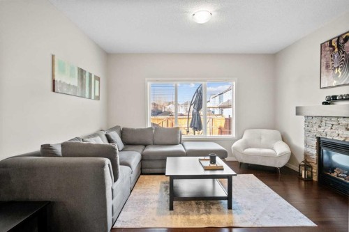 112 Copperpond Park, Calgary, AB - Indoor Photo Showing Living Room With Fireplace