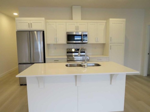 403-70 Sage Hill Walk Nw, Calgary, AB - Indoor Photo Showing Kitchen With Stainless Steel Kitchen With Double Sink With Upgraded Kitchen