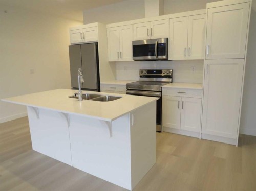 403-70 Sage Hill Walk Nw, Calgary, AB - Indoor Photo Showing Kitchen With Stainless Steel Kitchen With Double Sink