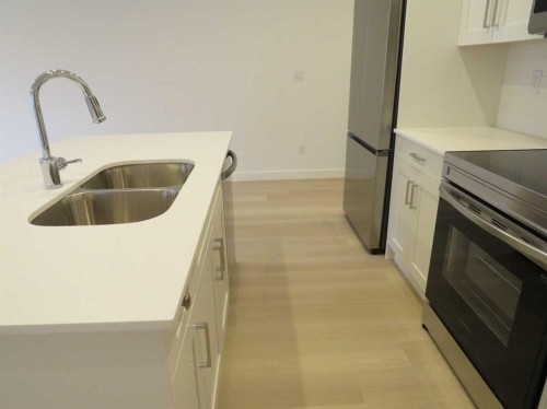 403-70 Sage Hill Walk Nw, Calgary, AB - Indoor Photo Showing Kitchen With Double Sink