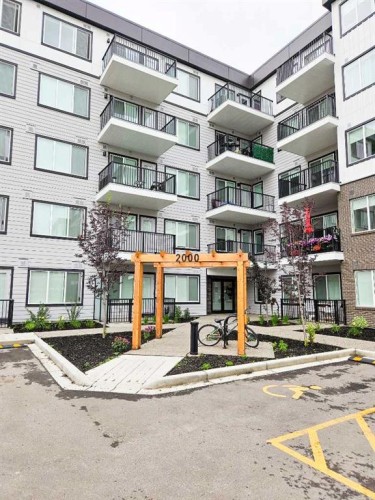 2413-111 Wolf Creek Drive Se, Calgary, AB - Outdoor With Balcony With Facade