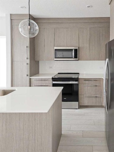2413-111 Wolf Creek Drive Se, Calgary, AB - Indoor Photo Showing Kitchen