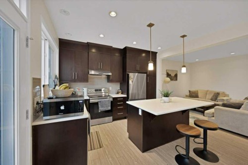 122 Kingfisher Crescent Se, Airdrie, AB - Indoor Photo Showing Kitchen With Stainless Steel Kitchen With Upgraded Kitchen