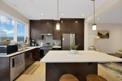 122 Kingfisher Crescent Se, Airdrie, AB - Indoor Photo Showing Kitchen With Stainless Steel Kitchen With Upgraded Kitchen