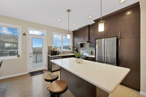 122 Kingfisher Crescent Se, Airdrie, AB - Indoor Photo Showing Kitchen With Stainless Steel Kitchen With Upgraded Kitchen