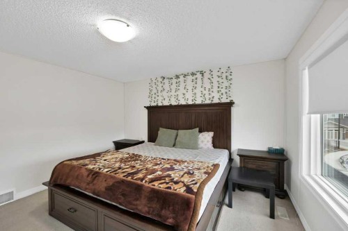 122 Kingfisher Crescent Se, Airdrie, AB - Indoor Photo Showing Bedroom