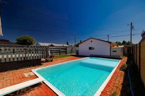 3236 Doverville Crescent Se, Calgary, AB - Outdoor With In Ground Pool