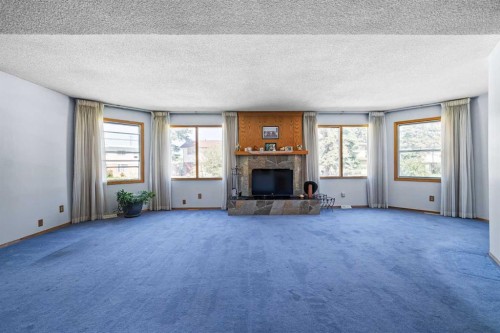 3236 Doverville Crescent Se, Calgary, AB - Indoor Photo Showing Living Room With Fireplace