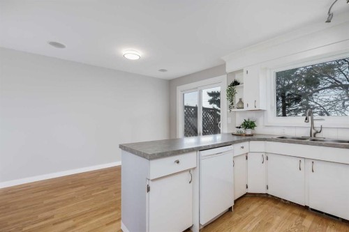 8111 Ranchview Drive Nw, Calgary, AB - Indoor Photo Showing Kitchen With Double Sink