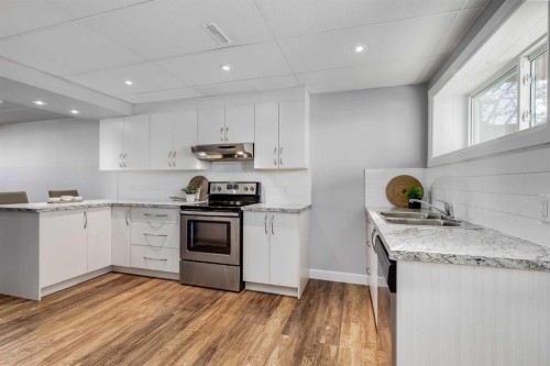 8111 Ranchview Drive Nw, Calgary, AB - Indoor Photo Showing Kitchen With Double Sink With Upgraded Kitchen