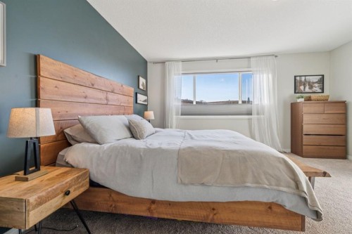 104 Bow Ridge Crescent, Cochrane, AB - Indoor Photo Showing Bedroom