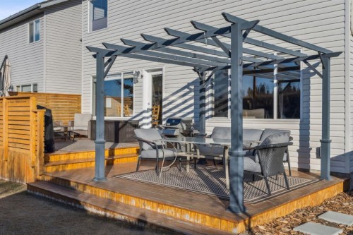 104 Bow Ridge Crescent, Cochrane, AB - Outdoor With Deck Patio Veranda With Exterior