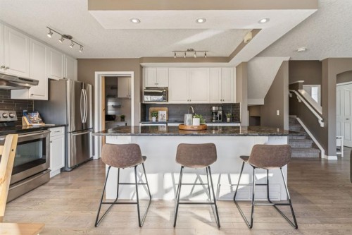 104 Bow Ridge Crescent, Cochrane, AB - Indoor Photo Showing Kitchen With Stainless Steel Kitchen With Upgraded Kitchen