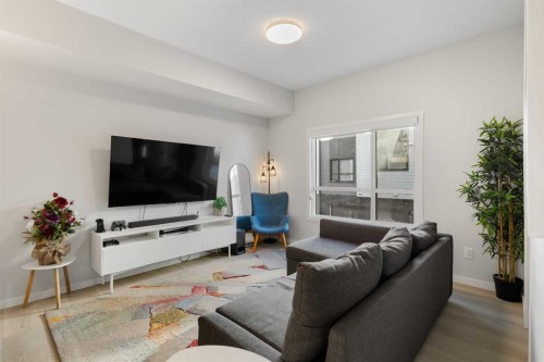 405-20295 Seton Way Se, Calgary, AB - Indoor Photo Showing Living Room