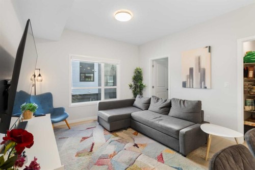 405-20295 Seton Way Se, Calgary, AB - Indoor Photo Showing Living Room