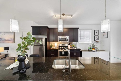 404 Redstone View Ne, Calgary, AB - Indoor Photo Showing Kitchen With Stainless Steel Kitchen With Double Sink With Upgraded Kitchen