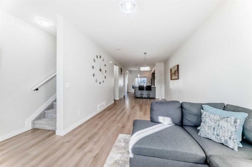 240 Copperleaf Way Se, Calgary, AB - Indoor Photo Showing Living Room