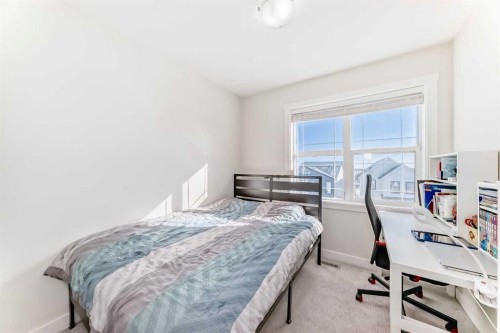 240 Copperleaf Way Se, Calgary, AB - Indoor Photo Showing Bedroom