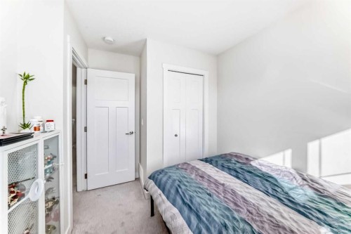 240 Copperleaf Way Se, Calgary, AB - Indoor Photo Showing Bedroom